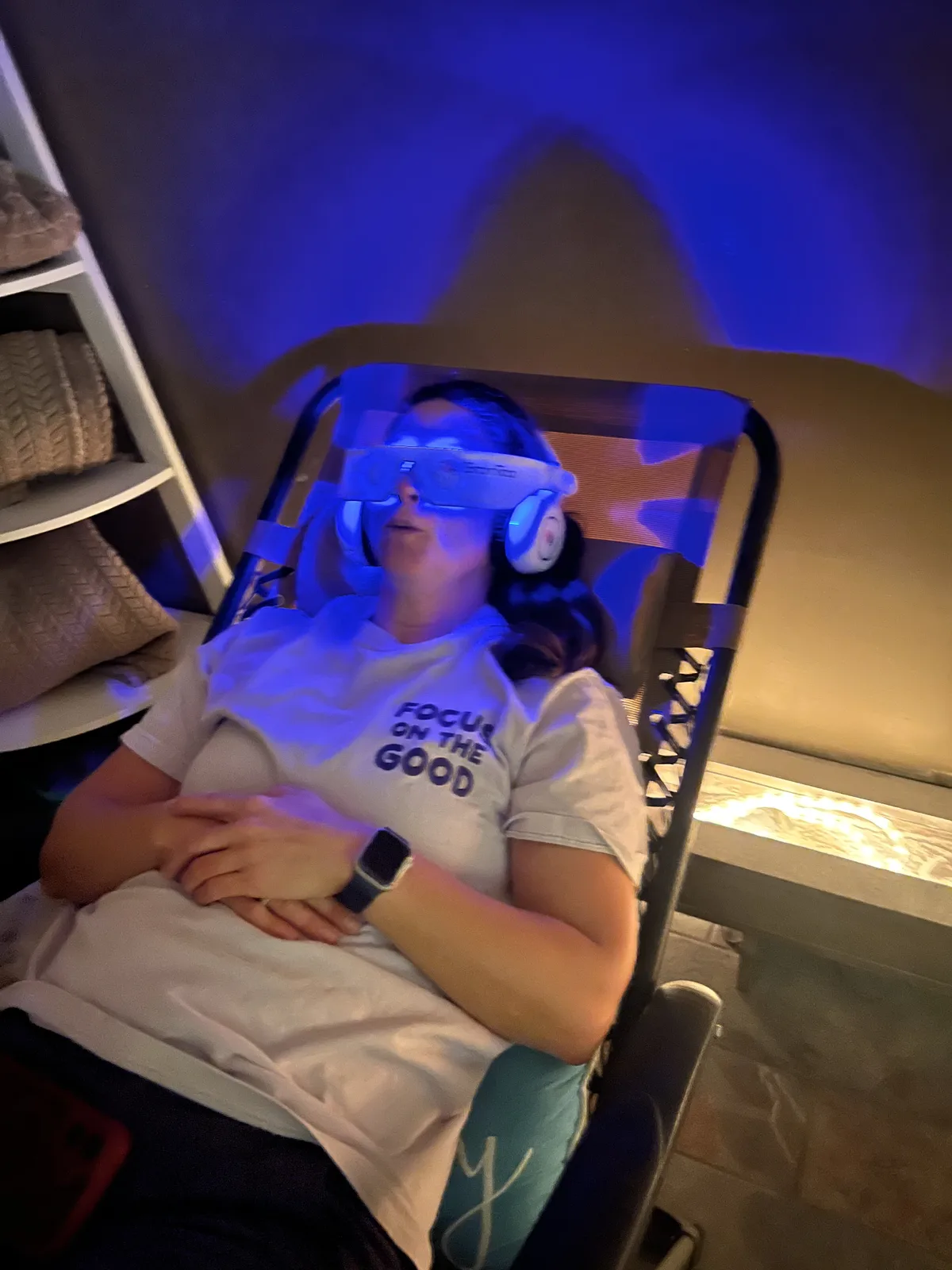 Client relaxing during a BrainTap session at Sweet Dreams Wellness � light stimulation and guided audio